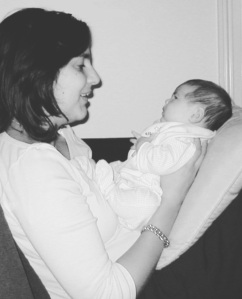 Black and white photo of me holding our baby daughter when she was only a couple of weeks old. 